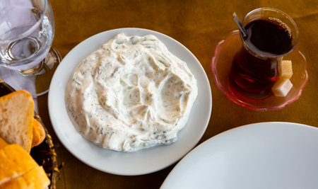 Tzatziki or cacik, cucumber and yogurt salad with mint closeup. Turkish cuisine