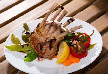 Roasted rack of mutton with vegetablesの写真素材