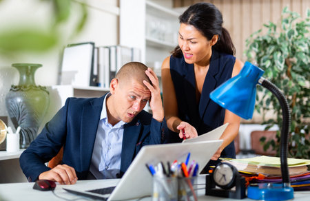 Unhappy chief screaming to upset managerの写真素材