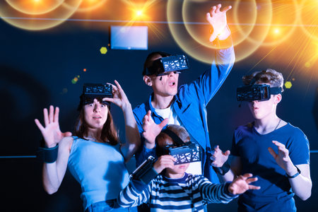 Emotional family having fun with vr headset gogglesの写真素材