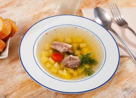 Light vegetable soup with slices of porkの写真素材