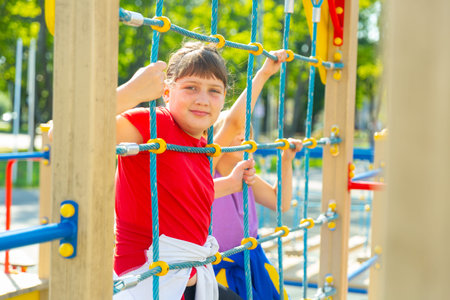 Portrait Of happy girlfriends playing outdoors on playground