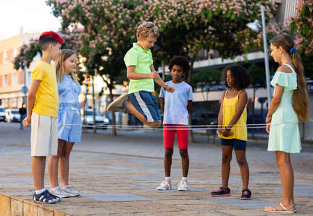 Kids playing together outdoorsの写真素材
