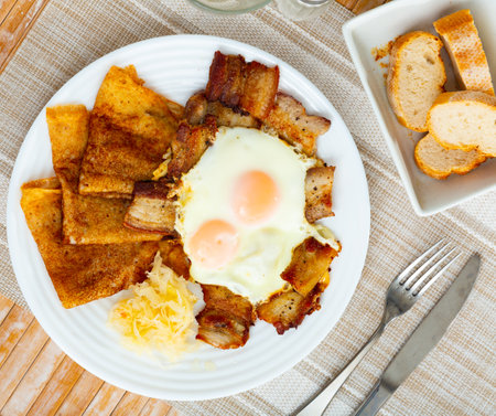 Pancakes with pork ham and fried eggsの写真素材