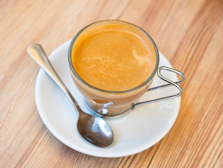 Image of cup of fresh coffee cortado on tableの写真素材