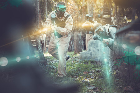 People in full gear playing paintballの写真素材