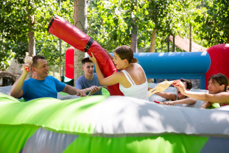 Happy people having fun in amusement park outdoorsの写真素材