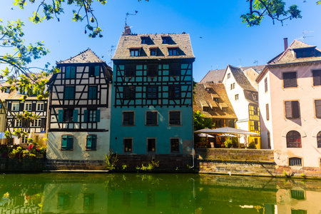 Summer day in Strasbourg, view of houses along canal
