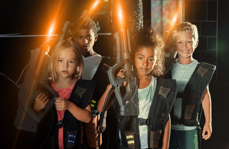 Group of casual tweenagers with laser gunsの写真素材