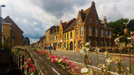 Neat residential stone houses along summer street of Diksmuide, Belgiumのeditorial素材
