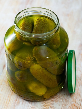 Glass jar of pickled cucumbersの写真素材