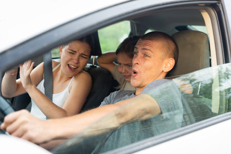 Shocked family frightened of accident during drivingの写真素材