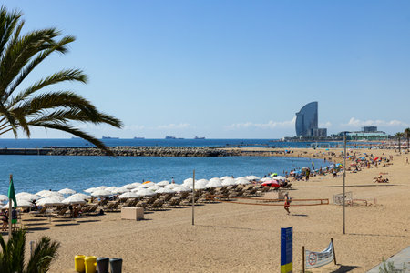 View on sandy beach of Barcelona in sunny day, Cataloniaのeditorial素材