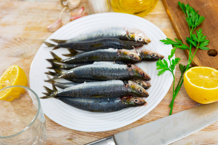 Fresh sardines on plate, fish dishの写真素材