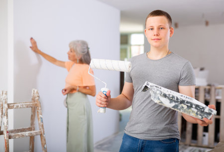 Teenage boy posing on indoor construction siteの写真素材