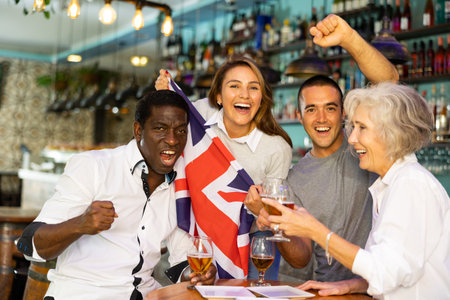 International group of people with UK flag toasting with beer, having fun at partyの写真素材