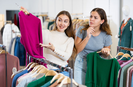 Woman with personal shopper shopping in storeの写真素材