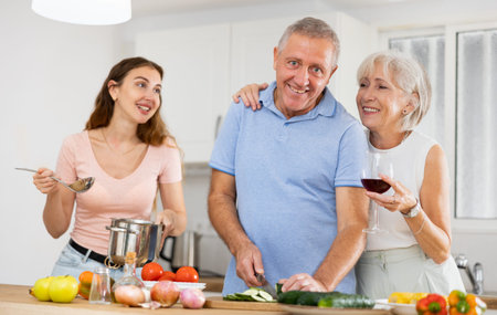 Happy family having fun and cooking together