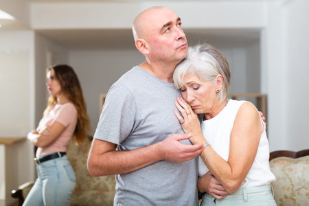 Portrait of loving husband comforting his wifeの写真素材