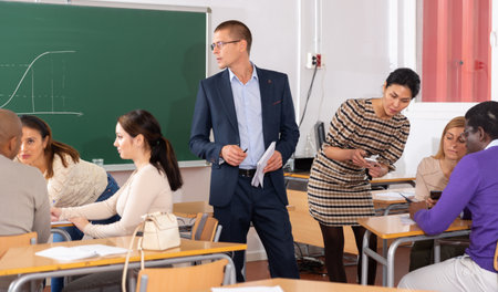 Teacher is giving lecture for students in classの写真素材