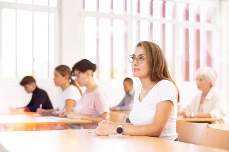 Attentive university students in advanced training courses in auditoriumの写真素材