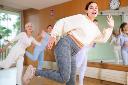 Dynamic young woman dancing hip-hop