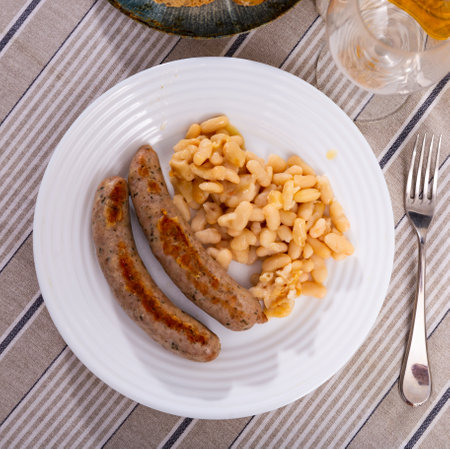 Fried pork sausage botifarra with stewed white beansの写真素材