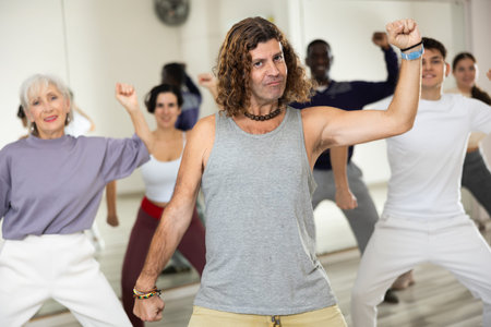 Group of multinational people practicing new modern dance techniques