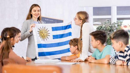 Teacher with flag of Uruguay tells story of the emergence of state