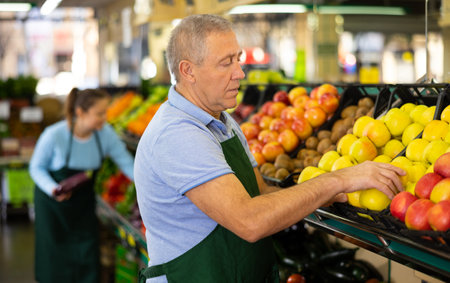man seller offers to buy applesの写真素材