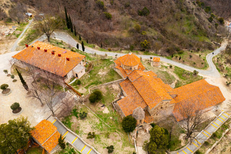 Top view of brownish tiled roofs of medieval Shio-Mgvime monastery, Mtskheta, Georgia
