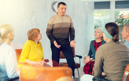 Mature man tells an interesting story. Retirees listen carefully