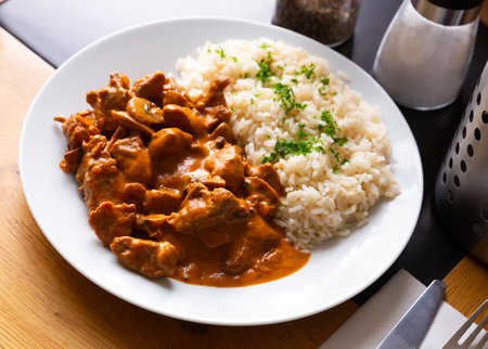 Tasty beef stroganoff with rice and parsley. Czech cuisineの写真素材