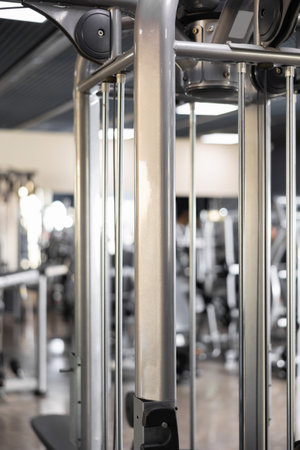 Shiny new lat pull down machine in middle of gym