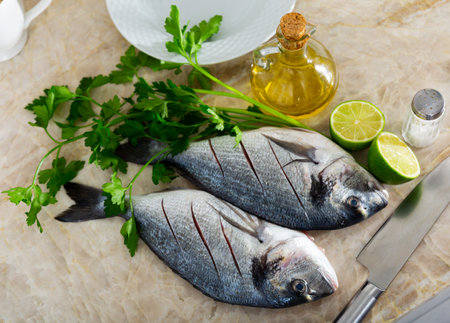 delicious and healthy lunch option is dorado baked with lime juiceの写真素材