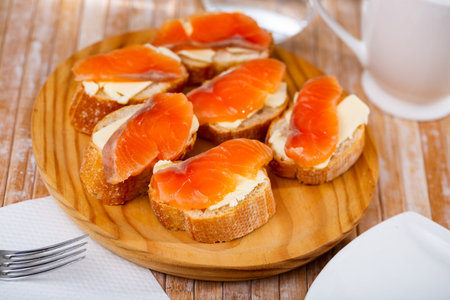 Appetizer canape of baguette with smoked salmonの写真素材
