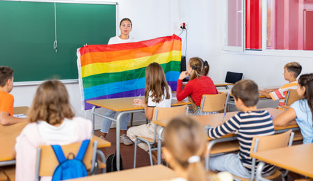Teacher explaining lesson about LGBTQ people to pupilsの写真素材