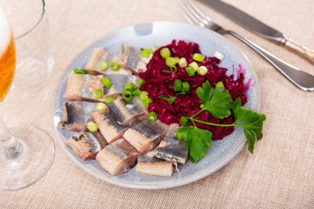 Lightly salted herring with beets served on platterの写真素材