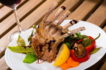 BBQ lamb carre served with vegetablesの写真素材