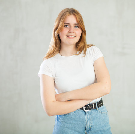 Portrait of young girl on grey background studio portrait