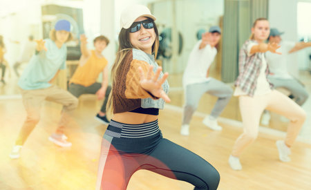 Teenagers dancing hip-hop in studio