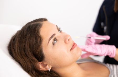 Young woman having mesotherapy procedure on her faceの写真素材
