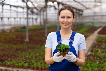 Adult woman posing with pot of peppermint
