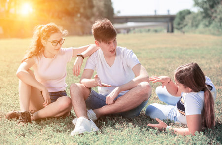 Portrait of teenagers on the summer green lawnの写真素材