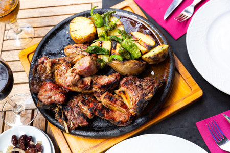 Fried beef served with potatoes and peppers