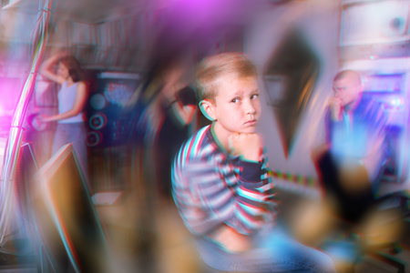 Pensive preteen boy solving riddles in quest room