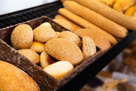 Baked baguettes on showcase in bakery shopの写真素材