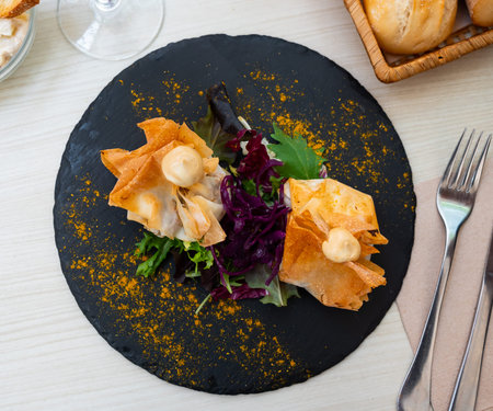 Delicious portion of sachets filled with pasta meat and vegetables
