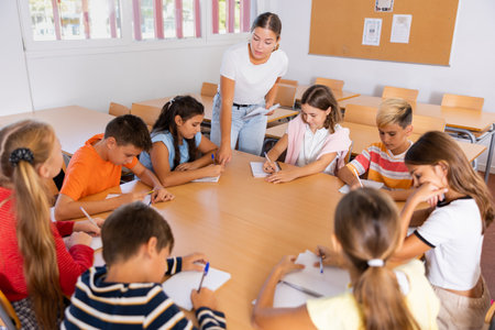 Group of girls and boys studying in schoolの写真素材