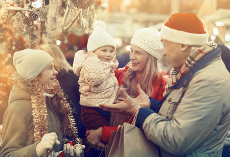 Parents and daughters at Christmas fairの写真素材